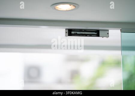 Electromagnetic door lock installed on a modern entrance provides secure access control and reliable protection for residential and commercial securit Stock Photo