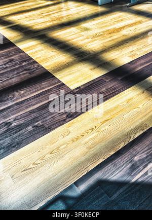 Long shadows spread across a floor Stock Photo