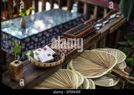 Traditional Chinese Abacus and Bamboo Fans on a Wooden Table Stock Photo