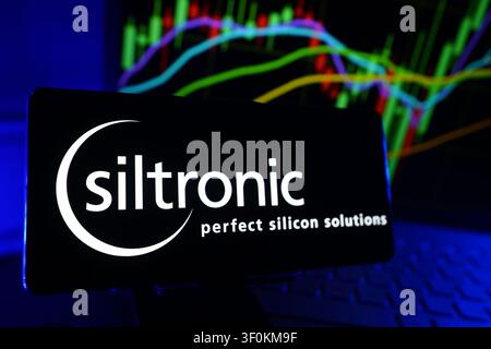 Siltronic Perfect Silicon Semiconductor Wafer Manufacturer Company Logo on Smartphone Display with Stock Market Performance Chart Stock Photo