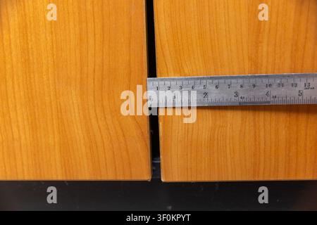 Problem big gaps between two leaning doors of old cabinet. Stock Photo