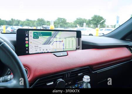 PLANO, TX, USA - JULY 06, 2026: A detailed view of the Mazda CX-7 PHEV interior showcasing its navigation system display. The Mazda CX-7 offers advanc Stock Photo