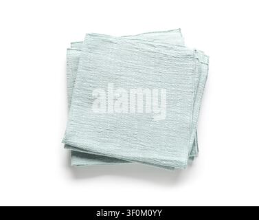 Stack of folded light blue kitchen towels or napkins with textured fabric, isolated on a clean white background Stock Photo