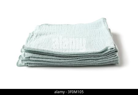 Stack of folded light blue cotton gauze kitchen towels for cleaning and drying, isolated on a white background Stock Photo