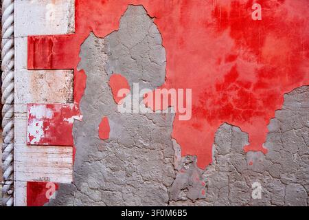 Stucco and old red paint on wall Stock Photo