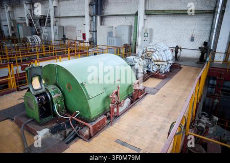 Interior of chemical enterprise shows high-pressure turbo compressor for supplying air separation units. Large mechanical facility powerful unit for i Stock Photo