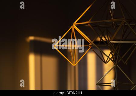 wooden decorative stick shape interior hanging object close up soft focus with blurred background Stock Photo