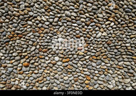 flint stone building wall on old house, north norfolk, england Stock Photo