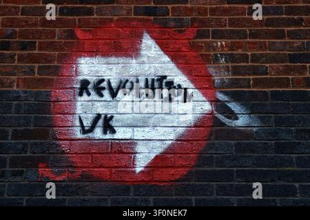 Slogan Painted on Brick wall ' Revolution UK' Stock Photo