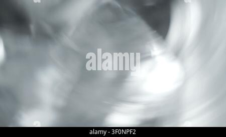 Abstract blurred motion light and soft grey white texture creating a dreamlike, ethereal background with bokeh effect Stock Photo