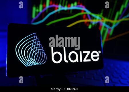 Blaize Inc Logo Displayed On A Smartphone Screen In Front Of A Computer Showing Stock Market Financial Performance Charts Stock Photo