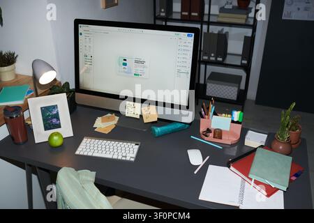 Home Office Workspace Displaying Ecommerce Product Design on Desktop Stock Photo