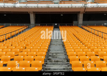 Empty stadium seats arranged in rows outdoors. Stock Photo