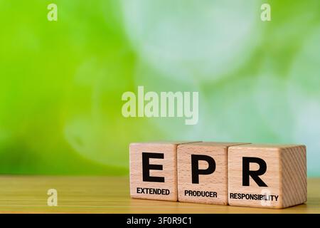 Wooden cubes from symbol EPR symbol and reveals Extended Producer Responsibility. A business-environmental concept. Coverage by companies operating in Stock Photo