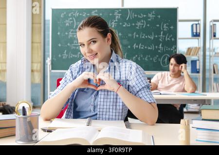 Young students taking the math exam in classroom Stock Photo