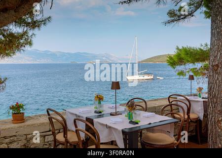 Restaurant terrace with set table in Korcula old town Stock Photo
