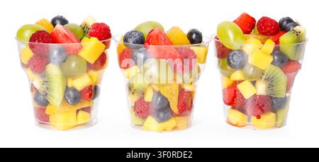Tasty fruits in plastic cups isolated on white. To go snack Stock Photo