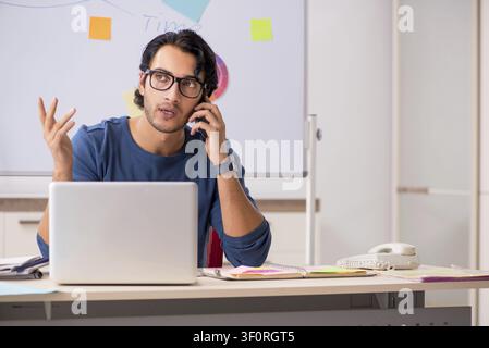 Young handsome designer working at the project Stock Photo