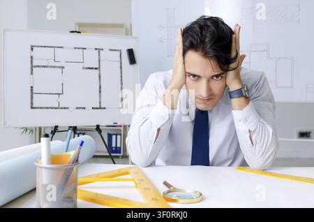Young handsome architect working on the project Stock Photo