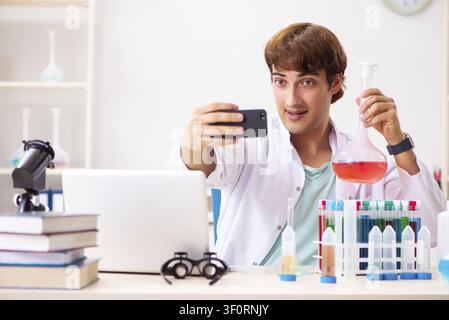 Young chemist working in the lab Stock Photo