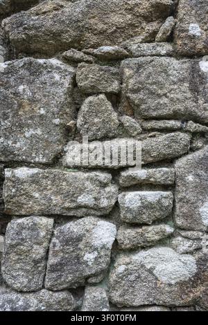 Masonry stones, weathered granite, filling the format, Carnac, Morbihan, Brittany, France Stock Photo