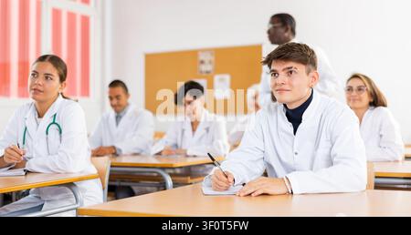 Medical students attending lecture in university Stock Photo