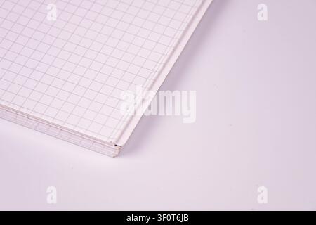 Stacked graph paper for planning and creativity, showcasing neat arrangement, uniform grid pattern, crisp white color, clean minimalistic setting, sof Stock Photo