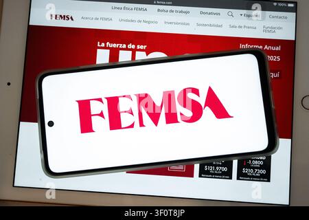 Mexico city, mexico, 06 04 2026, smartphone showing femsa logo laying on a tablet with the company website Stock Photo