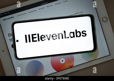 Mexico city, mexico, 06 04 2026, phone displaying elevenlabs logo over a tablet showing the company website Stock Photo