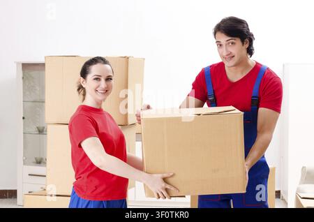 Professional movers doing home relocation Stock Photo