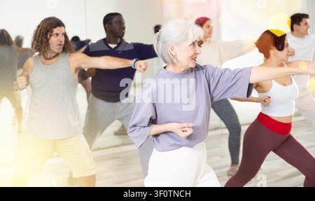 Group of multinational people practicing new modern dance techniques Stock Photo