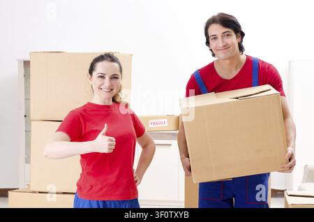 Professional movers doing home relocation Stock Photo