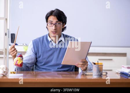 Young lecturer teacher teaching anatomy Stock Photo