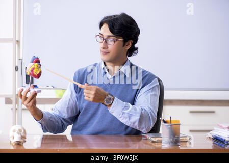 Young lecturer teacher teaching anatomy Stock Photo