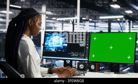 IT colleagues collaborate in a data center while reviewing AI diagnostics and infrastructure performance. Stock Photo