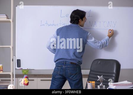 Young lecturer teacher teaching anatomy Stock Photo