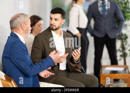 Mature man talking to company manager Stock Photo