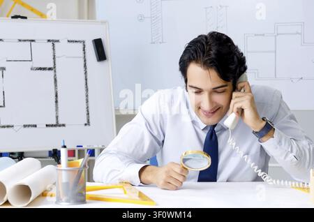 Young handsome architect working on the project Stock Photo