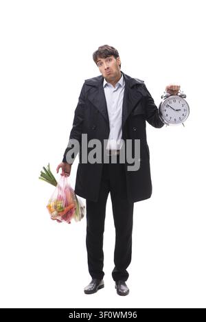 Young handsome man with vegatables in shopping concept Stock Photo