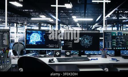 Server room computer screens tracking mainframes processing large scale machine learning datasets for AI operations, while computer displays tracking equipment used in AI model development. Stock Photo