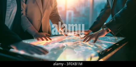 Dynamic image of business professionals collaborating and analyzing data on a futuristic interactive touchscreen table. The scene captures innovation, Stock Photo