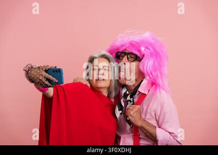 Senior couple actively enjoying taking a fun selfie Stock Photo