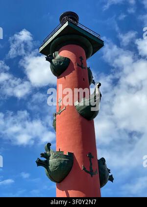 Saint Petersburg, Russia: May 8 2022 - Rostral Column against blue sky with dramatic clouds in Saint Petersburg Stock Photo