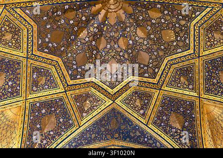 Gilded dome ceiling of Ak Saray Mausoleum in Samarkand with intricate floral and geometric patterns in gold and blue. Ideal for travel publications, c Stock Photo