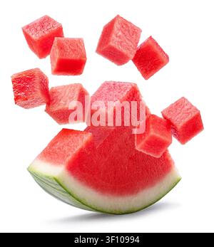 Watermelon triangle piece  and watermelon cubes levitating in air on it isolated on white background. File contains clipping paths. Stock Photo