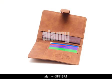Open brown cover for passport and bank cards isolated on white background. Stock Photo