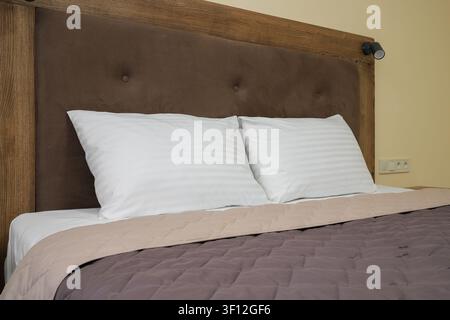 Two white pillows on hotel bed Stock Photo