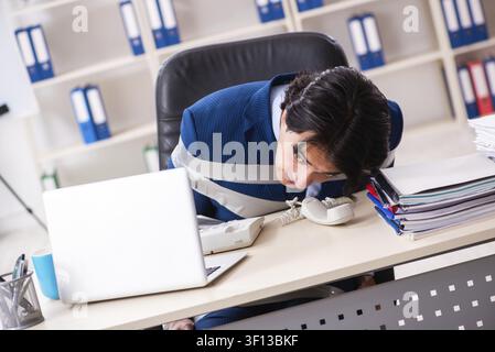 Young tied male employee in the office Stock Photo