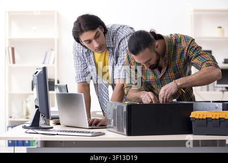 IT engineers working on hardware issue Stock Photo