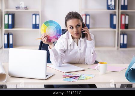 Female beautiful designer working in the office Stock Photo